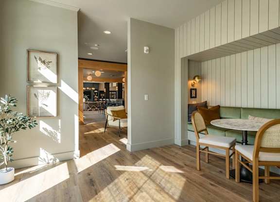 A dining area with a table and chairs.