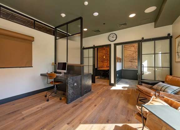 A room with a wooden floor and a glass wall.