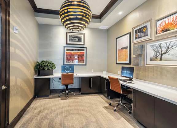 A modern office with a desk, chair, and computer.