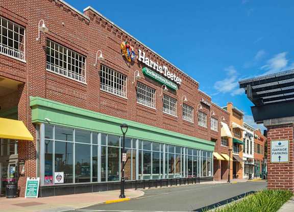 A Harris Teeter store is located in a strip mall.