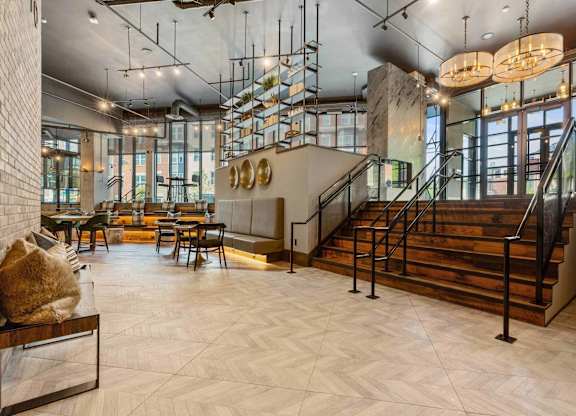A large open space with a staircase and a couch.