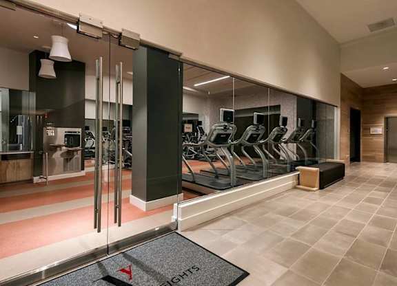 A gym with treadmills and exercise equipment.