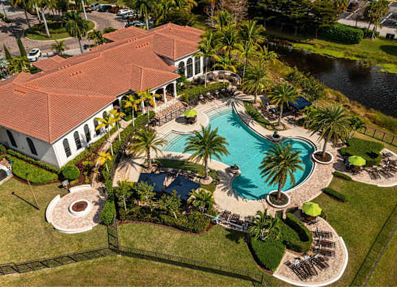 A large house with a pool in the backyard.