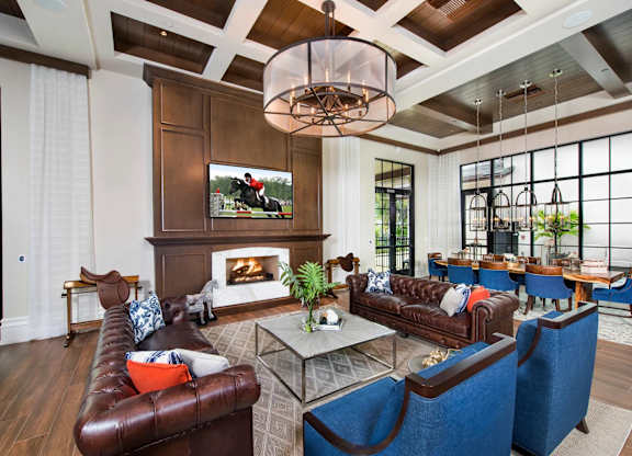 A modern living room with a fireplace and a television.