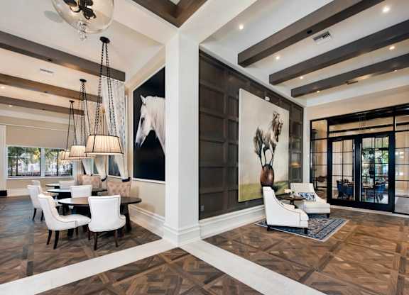 A modern living room with a large painting of a horse on the wall.