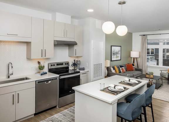 A modern kitchen with a dining area.