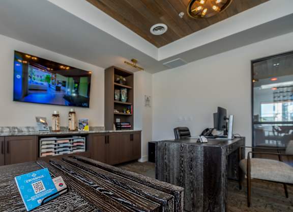 A modern living room with a television and a coffee table.