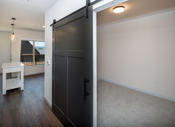 a sliding door in a living room and a dining room at The Crossings  at Windsong, Prescott Valley