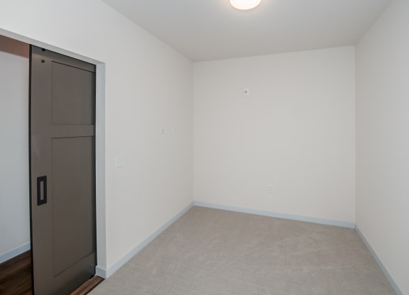 an empty room with a door to a closet at The Crossings  at Windsong, Prescott Valley