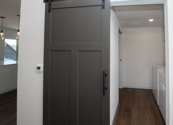 a large grey door in a room with a hallway at The Crossings  at Windsong, Arizona