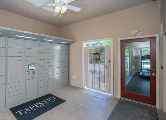 a garage with a door and a ceiling fan