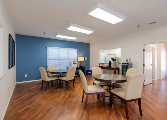 a dining room and living room with a table and chairs