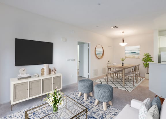 Ventura, CA Apartments - Cypress Meadows - Living Room with Mounted Television and Carpet
