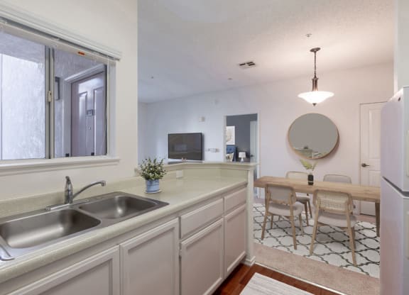 Retirement Homes in Ventura, CA - Cypress Meadows - Kitchen with Granite-Style Countertops and Spacious Windows