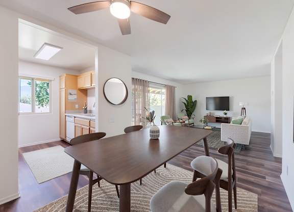 A modern dining room with a wooden table and chairs.