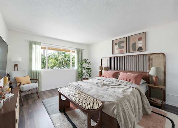 A bedroom with a bed, nightstand, and chair.