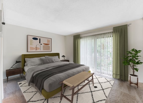 Goleta, CA Apartments Near UCSB - Encina Meadows - Spacious Bedroom with Carpeted Flooring, Large Bed, Footboard Bench, Wooden Nightstands with Lamps, Houseplant, White Walls, and Large Window with Green Curtains.