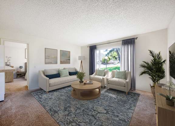 A living room with a couch, chair, and coffee table.