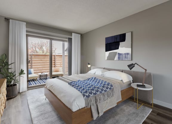 a bedroom with a large bed and a large window
