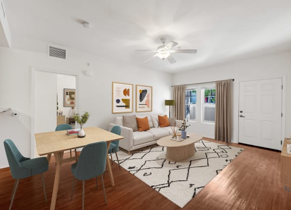 a living room and dining room with a couch and a table