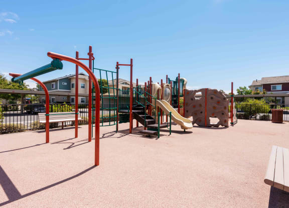 Santa Maria, CA, Apartments Near Walmart - Siena - Gated Playground with Slides, Climbing Structures, and Benches