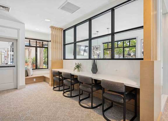 A room with a long table and chairs.