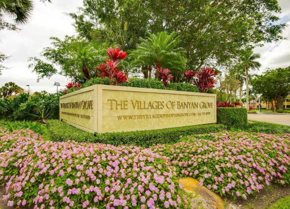 Entrance sign at The VillagesApartment  of Banyan Grove Apartments in Boynton Beach FL
