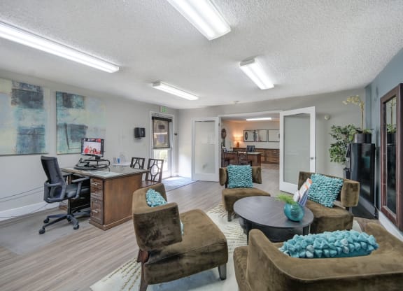 Asbury Place Apartments leasing office with lounge chairs and management desks