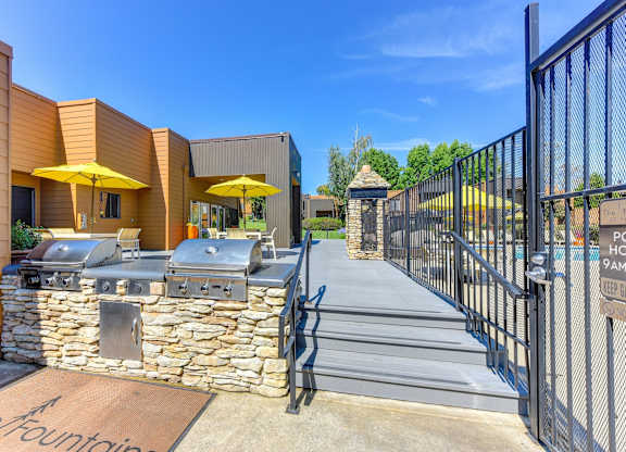 BBQ Area with Yellow Umbrellas, Grills, Gates with View of Pool at Fountains of Fair Oaks, Fair Oaks, 95628