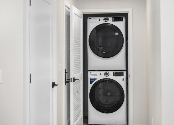 a small laundry room with a washer and dryer