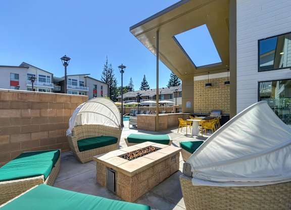 A Patio with a Table and Chairs at Canyon Terrace Apartments, California, 95630