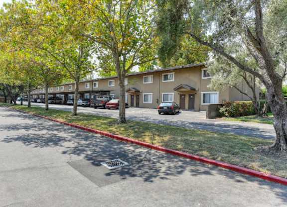 Community Exterior with Street, Grass and Trees  at Olympus Park Apartments, Roseville, CA, 95661