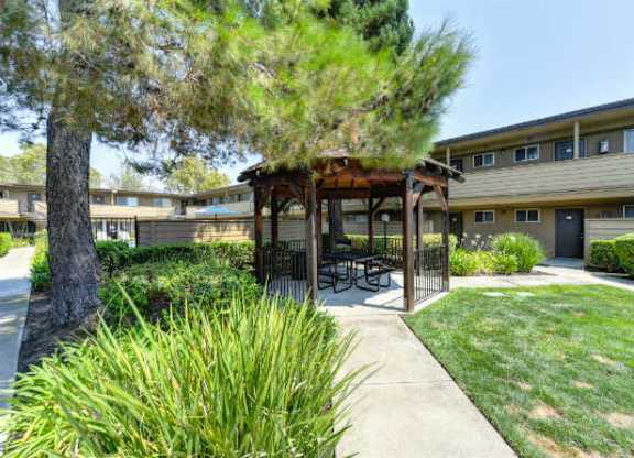 Outdoor Space with Gazebo with Grass, Walkways and Trees  at Olympus Park Apartments, Roseville, California