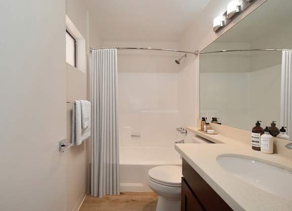 a bathroom with a shower toilet and sink at Croft Plaza Apartments, West Hollywood, 90069