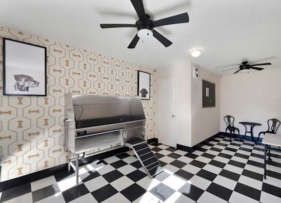 A black and white checkered floor in a room with a fan at Fountains of Fair Oaks, Fair Oaks