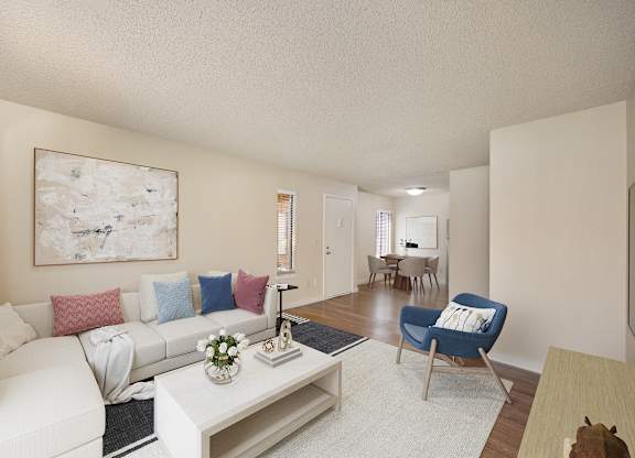 a living room with a white couch and a coffee table at Fountains of Fair Oaks, California