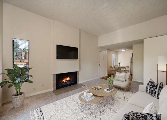 a living room with a fireplace and a couch at Fountains of Fair Oaks, California