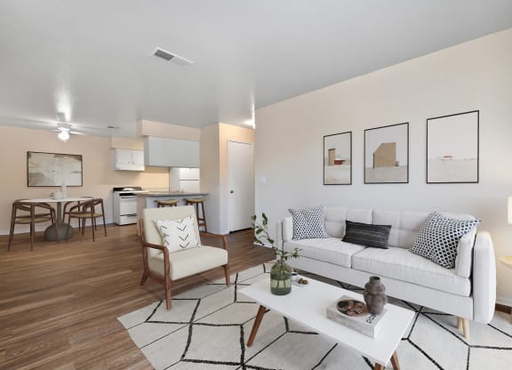 a living room with a white couch and a table