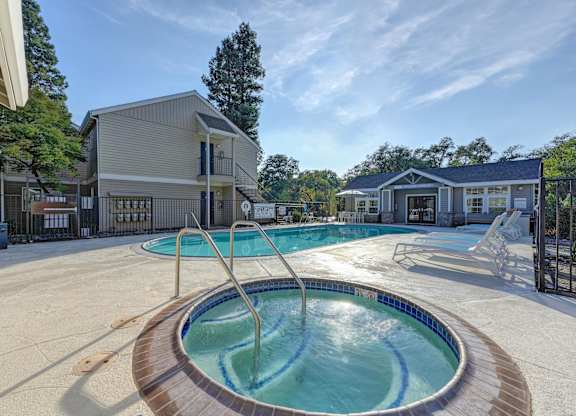 our apartments have a resort style pool with a hot tub at Hidden Oaks Apartments, Citrus Heights, California