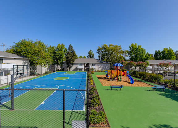 Basketball Court On-site with playground right next to it.at The Renaissance Apartments, Citrus Heights