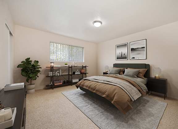 A bedroom with a bed, nightstand, and a plant.
