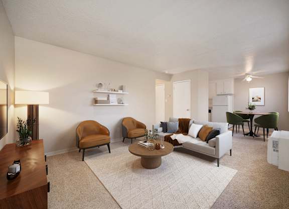 A living room with a couch, chairs, and a coffee table.