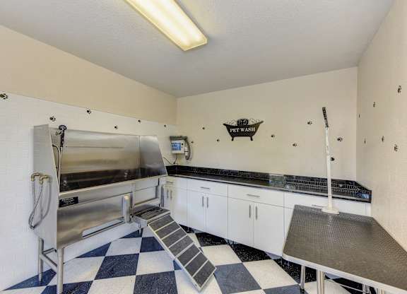 Pet Spa with dog Grooming Station with sink, Checker Patter Floor,and Table at Hidden Oaks Apartments, Citrus Heights, 95621