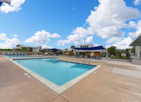 Pool with Lounge Chairs, Blue Skies with Clouds at Addison Ranch Apartments, Petaluma, California
