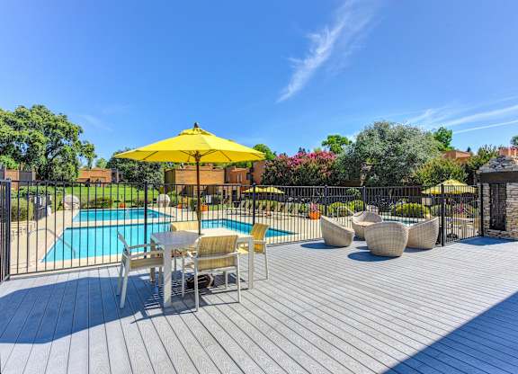 Pool Lounge  Area  with Yellow Umbrellas, Grills, Wicker Chairs, Gates with View of Pool at Fountains of Fair Oaks, Fair Oaks, CA