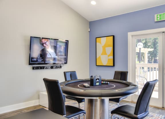 Community clubhouse with gaming table at Renaissance Park Apartments, California