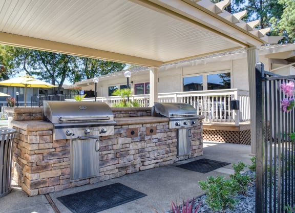 Community covered outdoor kitchen with two bbq grills at Renaissance Park Apartments, Davis, CA