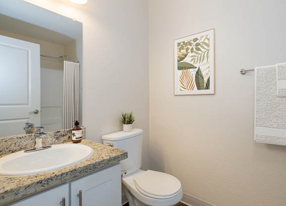 A Bathroom with a Toilet at Rocklin Manor Apartments, Rocklin, CA
