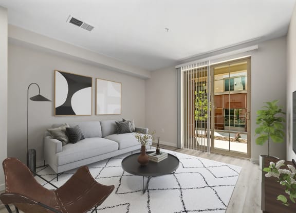 a living room with a white couch and a black coffee table