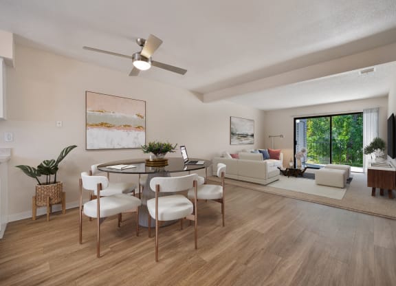 an open living room and dining room with a table and chairs at Silverstone Apartments, Davis, CA, 95618